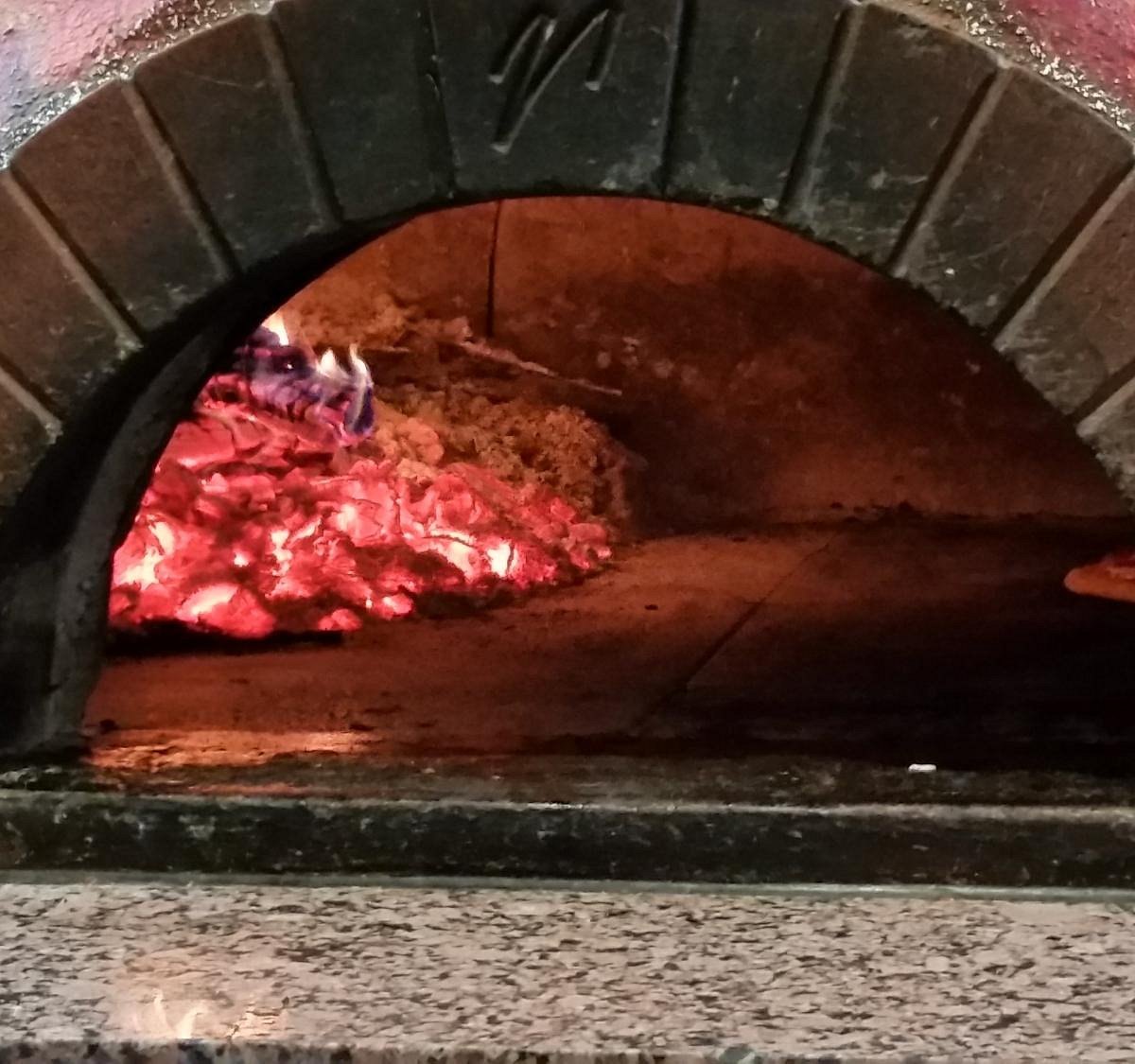 Flames rolling inside our brick oven